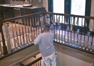 pictures of a man, painting near the stairs