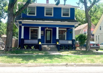 picture of a blue two story house
