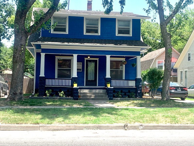 picture of a blue two story house